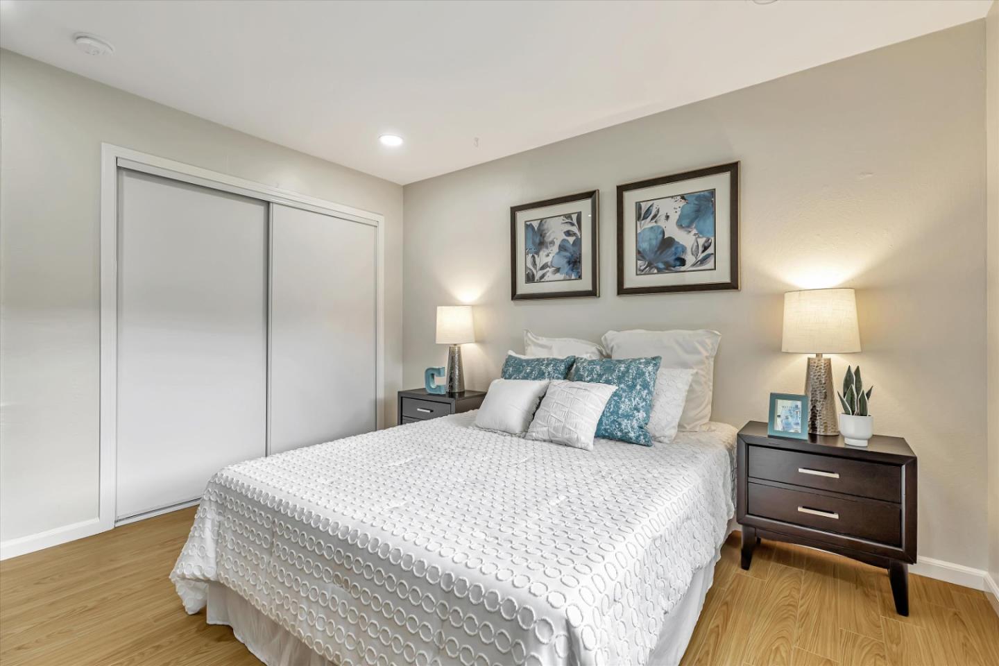 146 Brahms Way Sunnyvale, CA 94087 - Photo 13 of 24 a bedroom with a bed and wooden floor