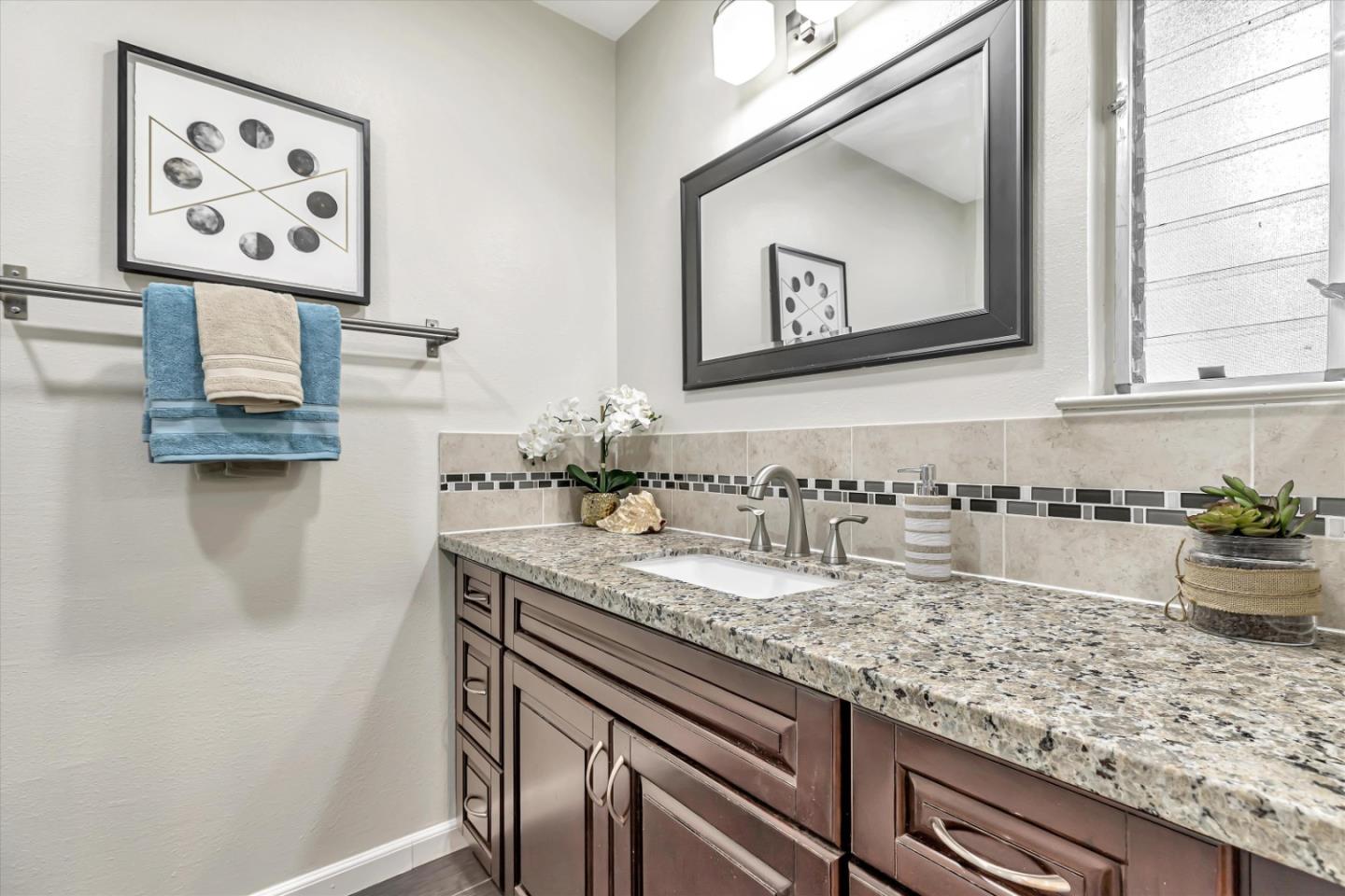 146 Brahms Way Sunnyvale, CA 94087 - Photo 16 of 24 a bathroom with sink and mirror