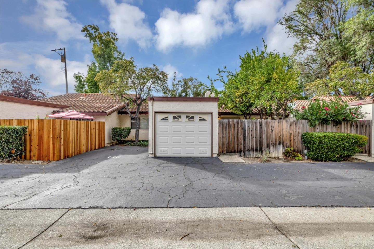 146 Brahms Way Sunnyvale, CA 94087 - Photo 21 of 24 a view of a house with a yard and wooden fence