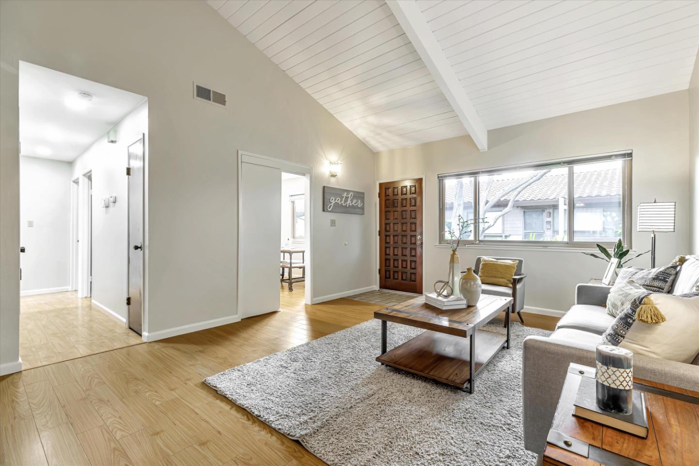 146 Brahms Way Sunnyvale, CA 94087 - Photo 3 of 24 a living room with furniture and floor to ceiling window