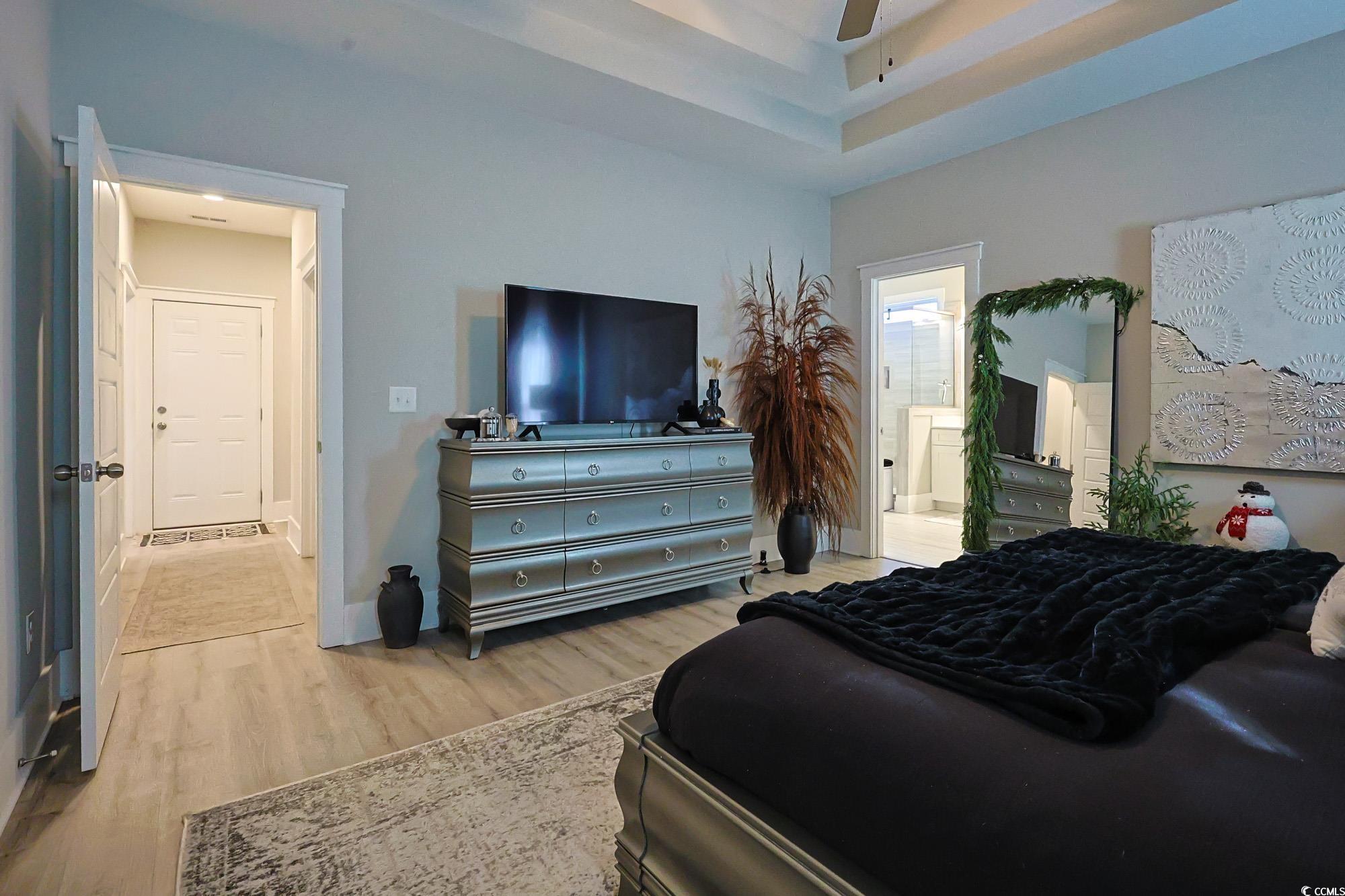 669 Pacific Commons Drive Surfside Beach, SC 29575 - Photo 11 of 36 Bedroom with light wood-type flooring and ensuite bathroom