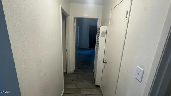 a view of a bathroom from a hallway