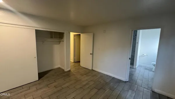 a view of hallway with wooden floor