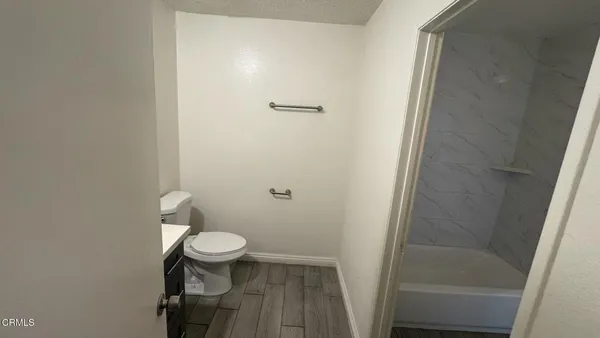 a bathroom with a toilet and a sink