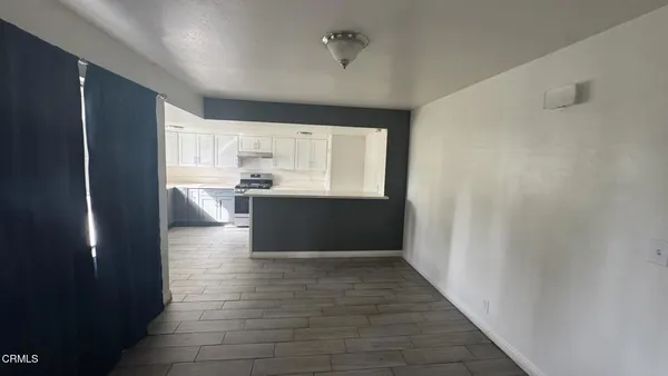 a view of kitchen with wooden floor