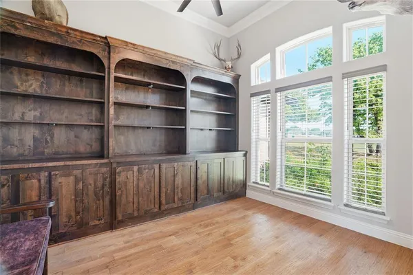 a view of a room with shelves on the wall