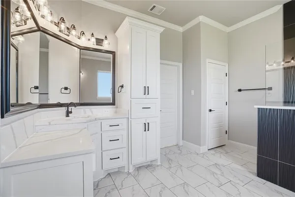 a spacious bathroom with a double vanity sink mirror and