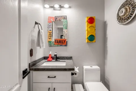 a bathroom with a sink double vanity and a mirror
