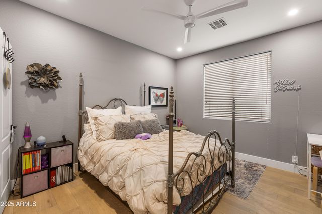 a bedroom with furniture and a window