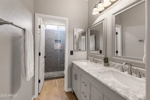 a living room with furniture and a dining table