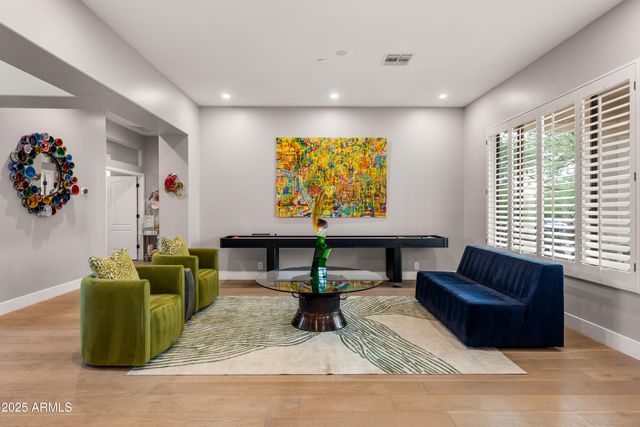 a view of a swimming pool with a patio