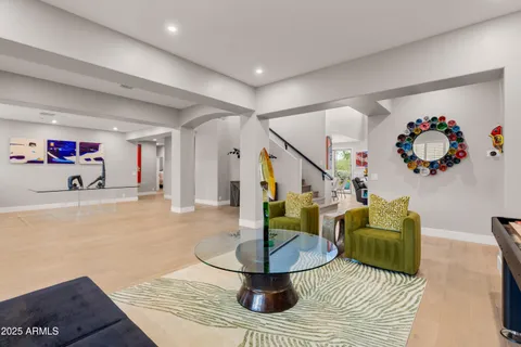 a view of a patio with chairs and potted plants