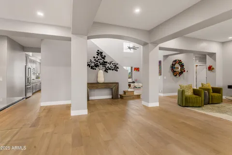 a view of a patio with table and chairs potted plants with palm trees