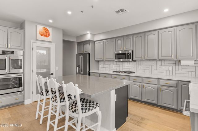 a living room with furniture rug and window