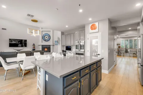 a hallway with furniture and wooden floor