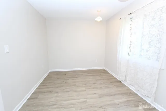 a view of a small space with wooden floor