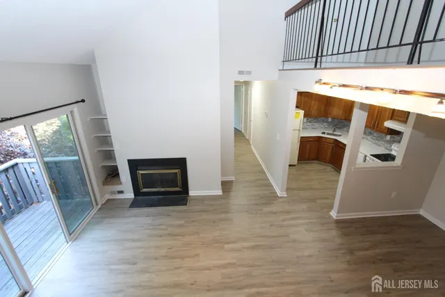 a view of kitchen with furniture and wooden floor