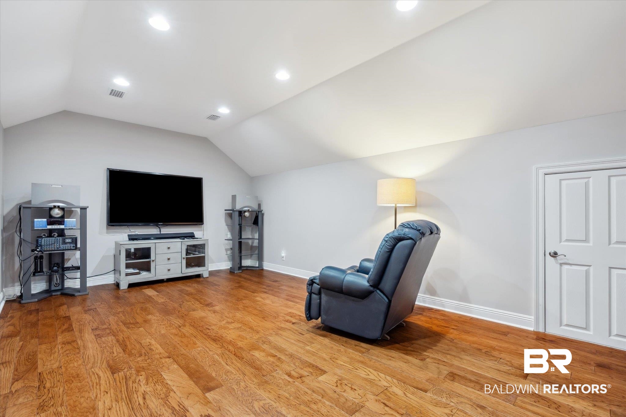 804 Country Club Road Mobile, AL 36609 - Photo 29 of 63 Living area featuring light hardwood / wood-style flooring and vaulted ceiling