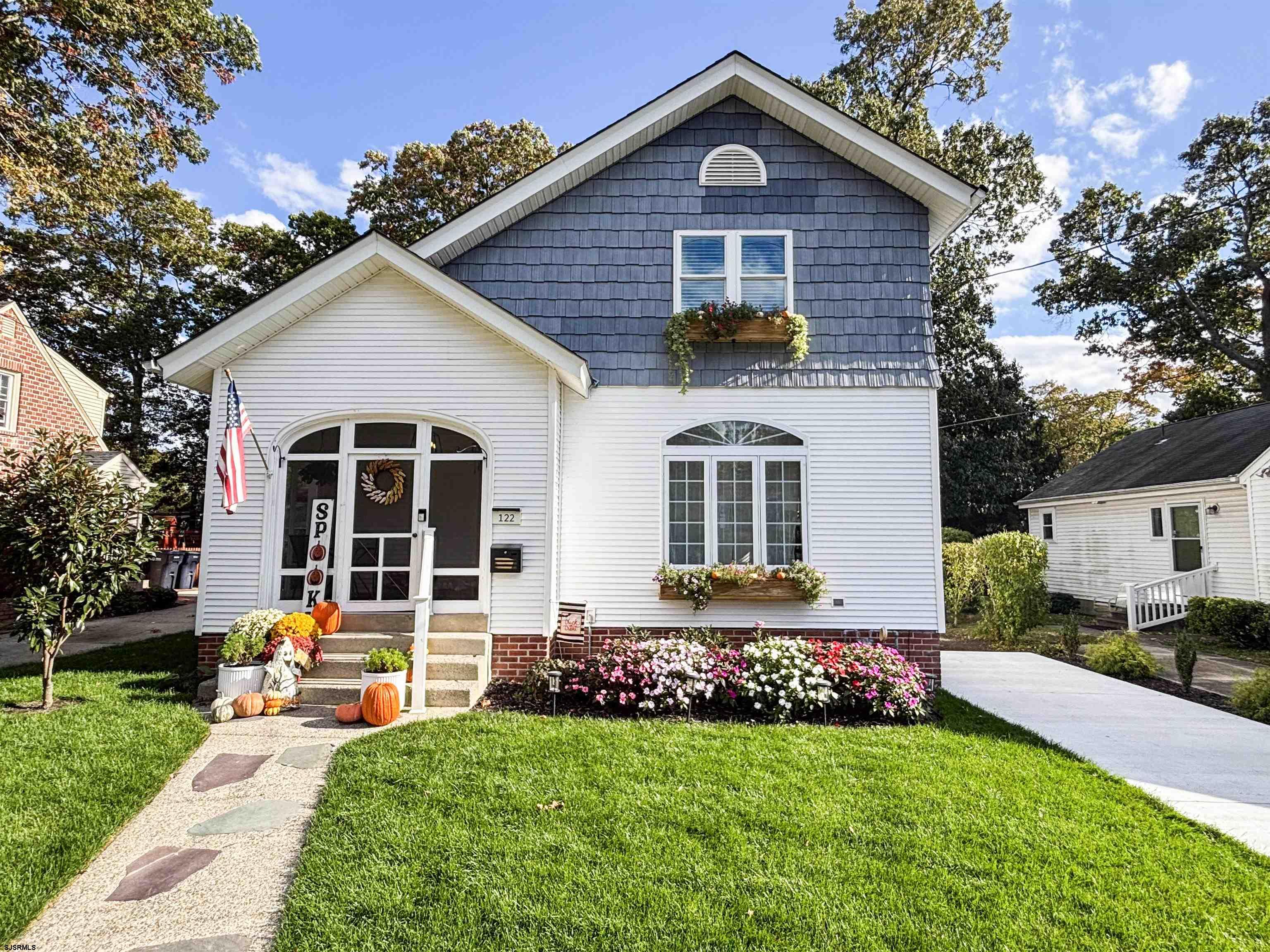 a front view of house with yard and green space