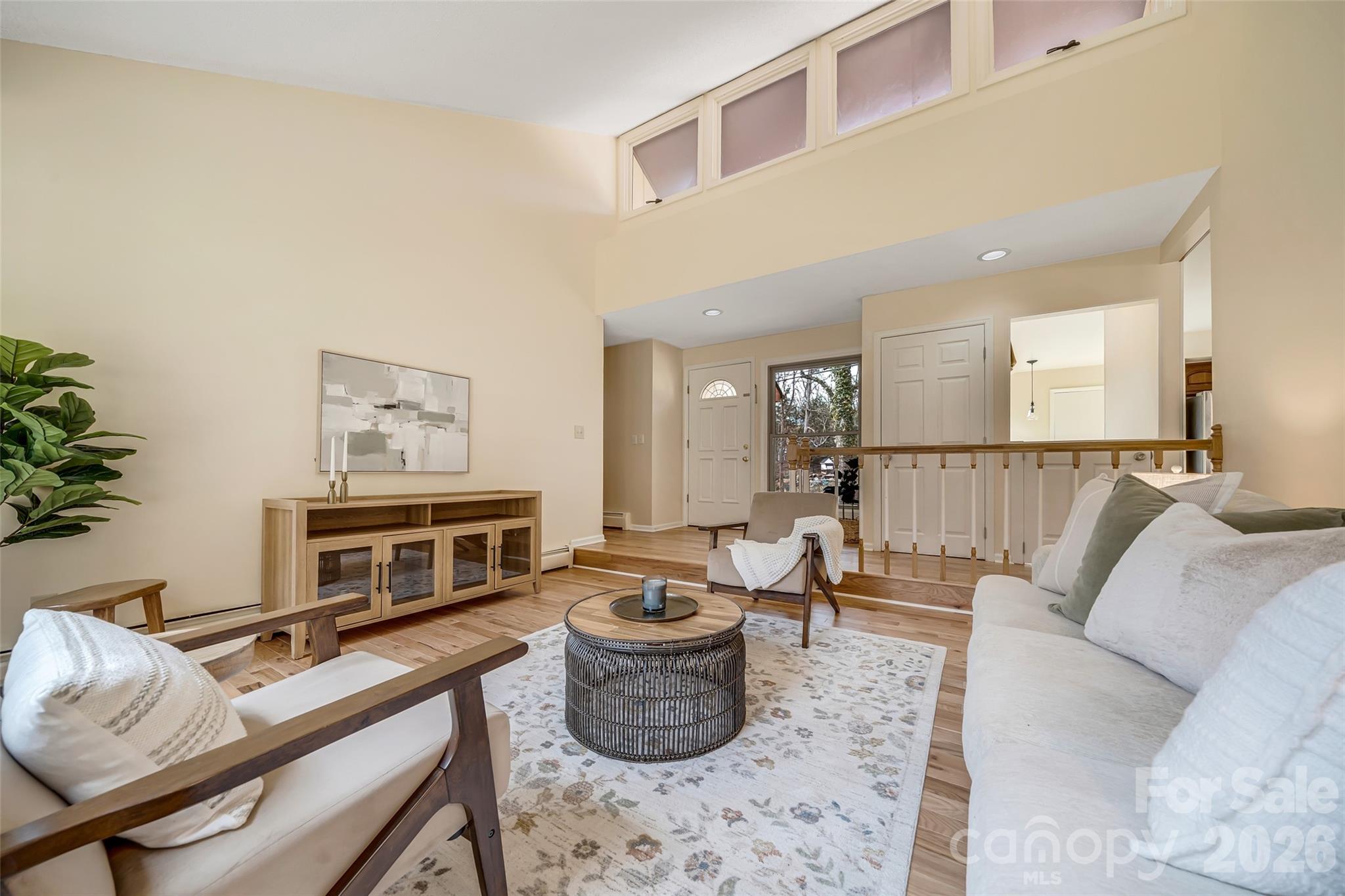 63 Pinecroft Road Asheville, NC 28804 - Photo 11 of 48 a living room with furniture and a wooden floor