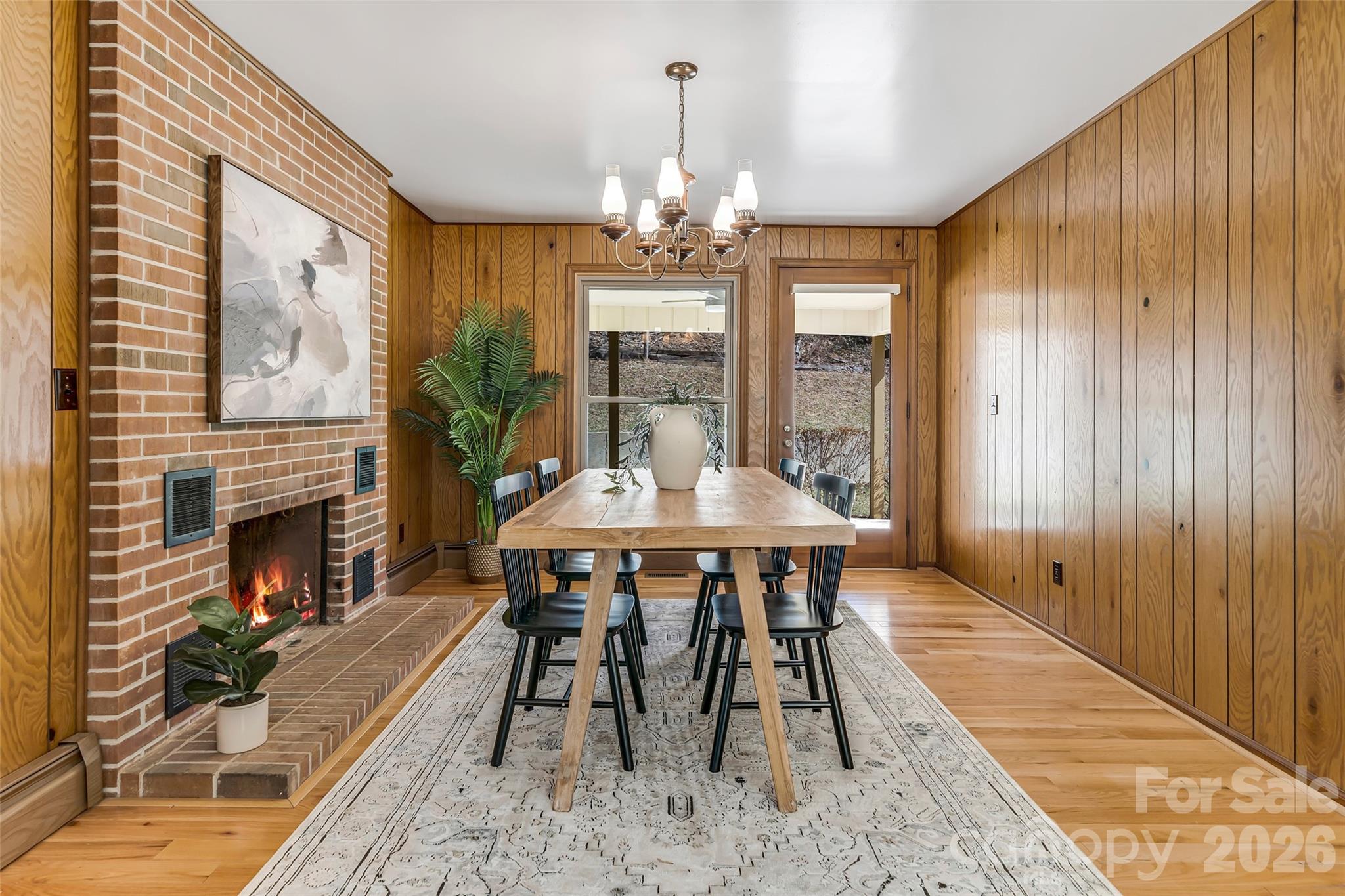 63 Pinecroft Road Asheville, NC 28804 - Photo 19 of 48 a view of a dining room with furniture window and wooden floor