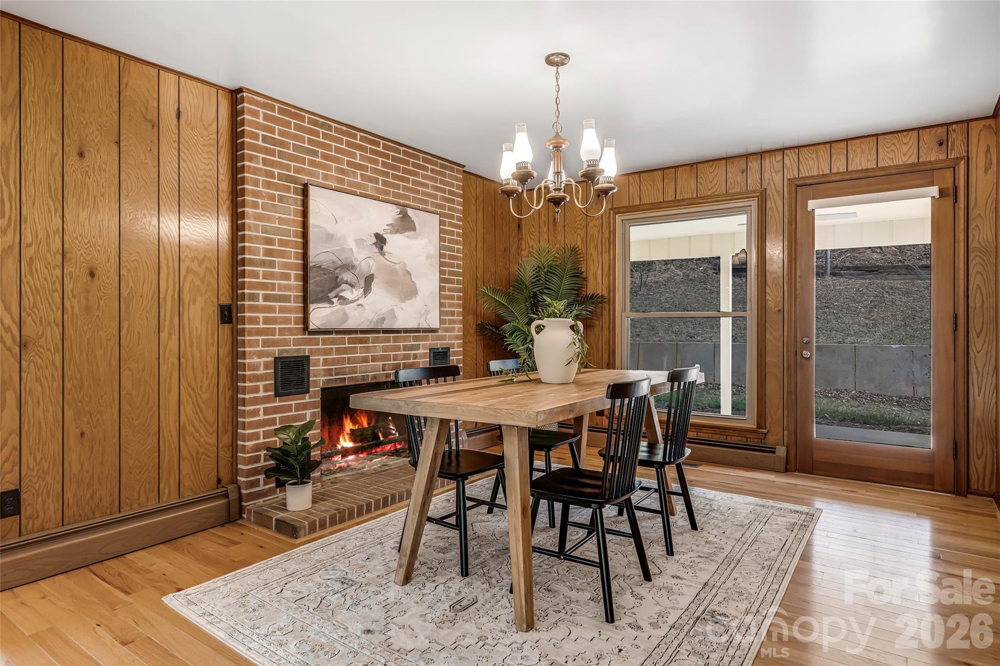 63 Pinecroft Road Asheville, NC 28804 - Photo 20 of 48 a view of a dining room with furniture window and wooden floor