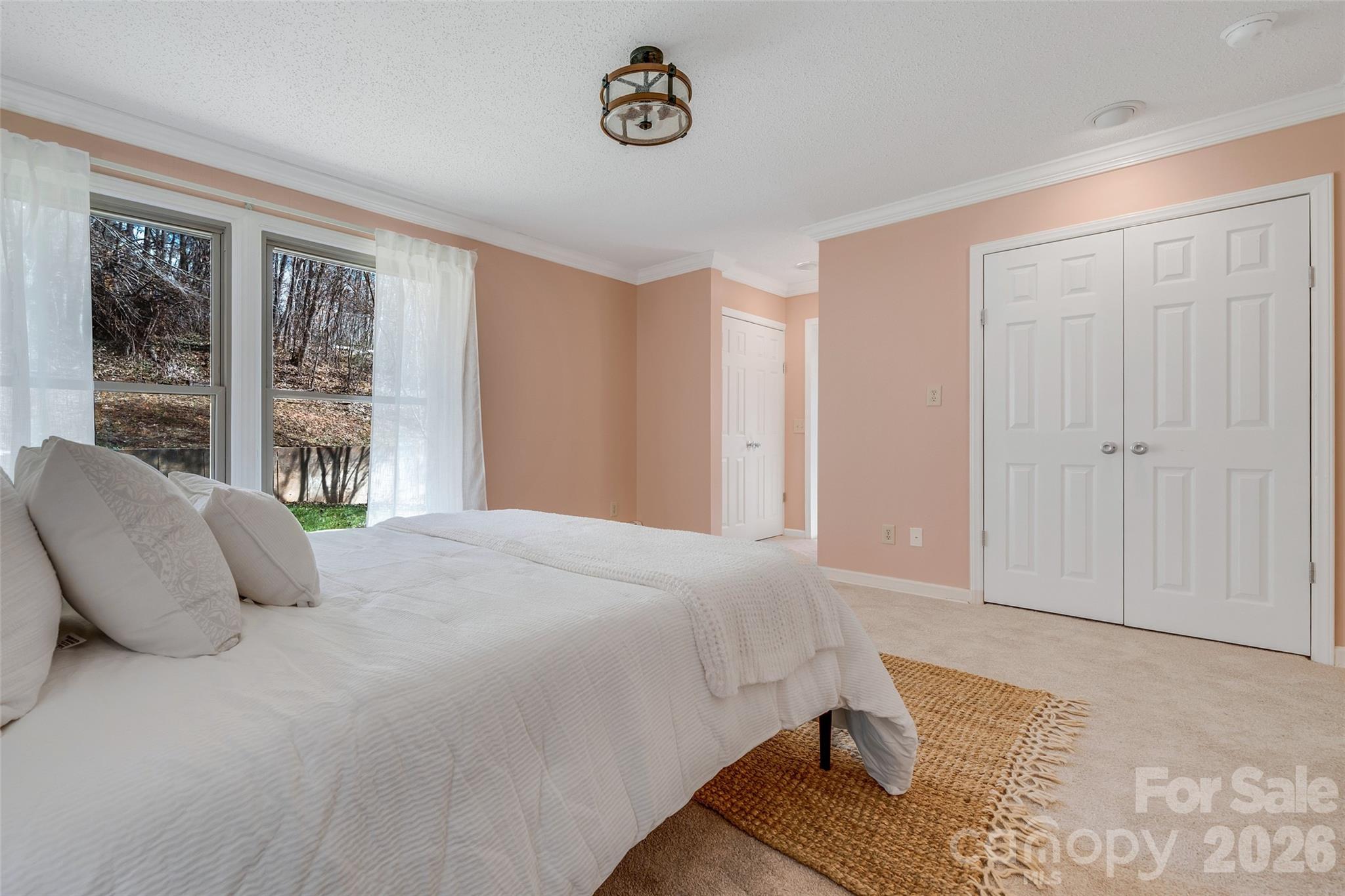 63 Pinecroft Road Asheville, NC 28804 - Photo 30 of 48 a bedroom with a bed and window