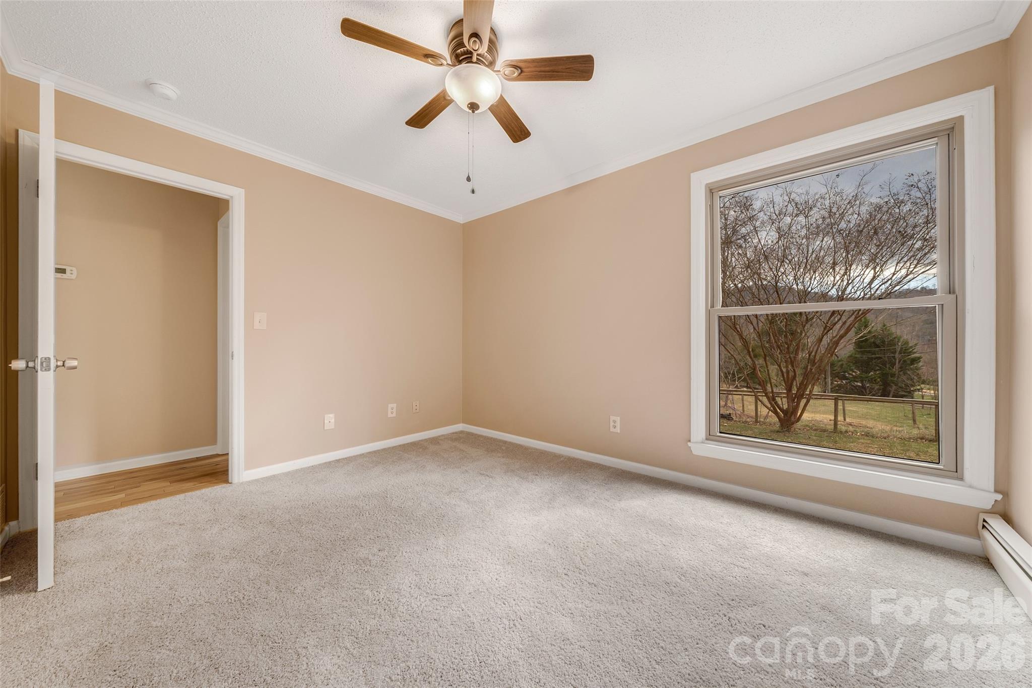 63 Pinecroft Road Asheville, NC 28804 - Photo 37 of 48 a view of an empty room with a window