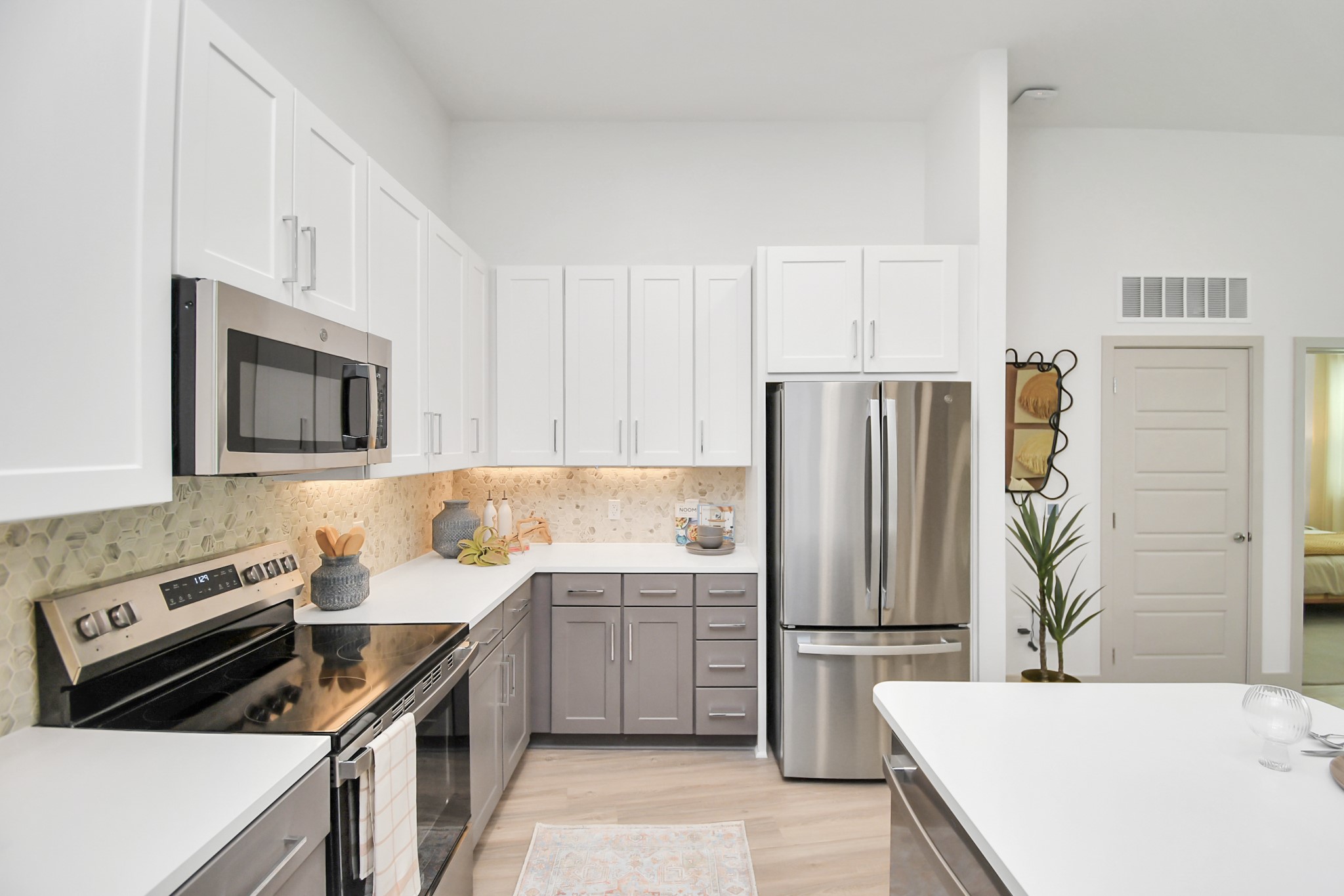 1617 Enid Street, Unit 177 Houston, TX 77009 - Photo 5 of 50 a kitchen with a sink a stove and refrigerator