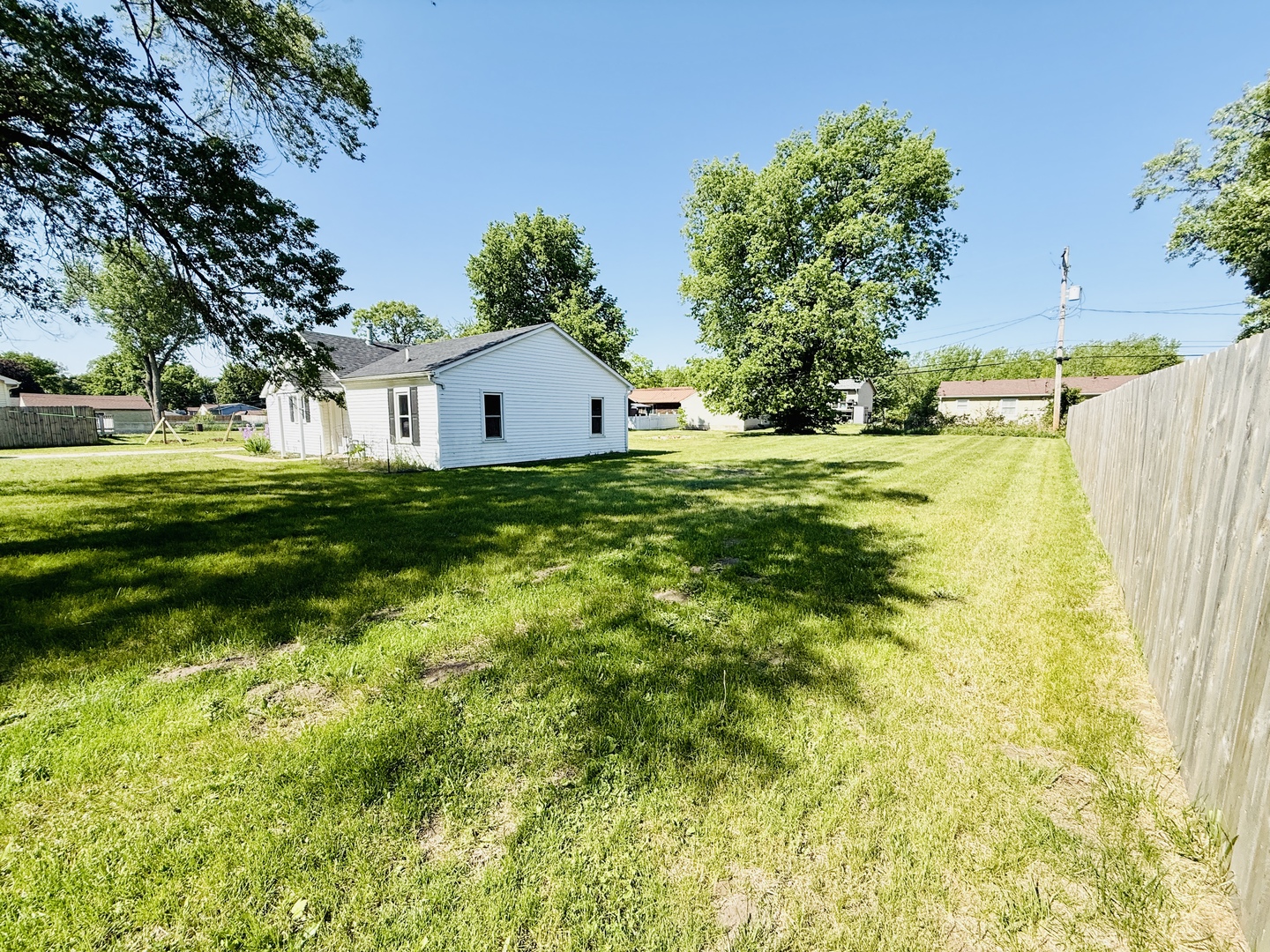 715 8th Street Colona, IL 61241 - Photo 13 of 14 a front view of a house with a yard