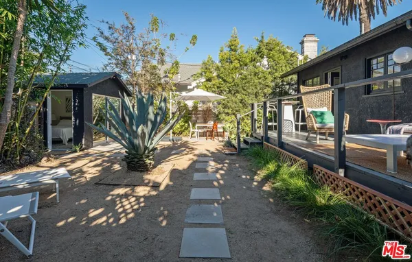a view of a pathway with a yard