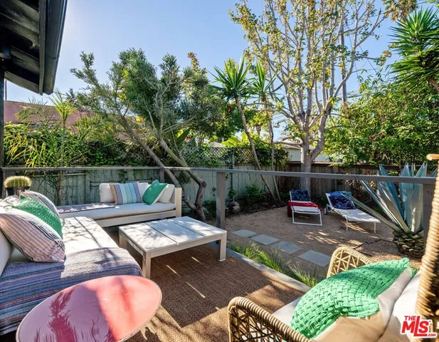 a view of a backyard with furniture