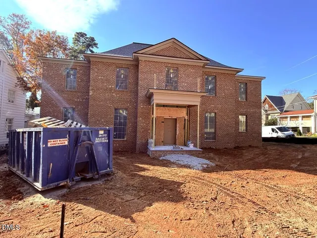 a front view of a house with parking space