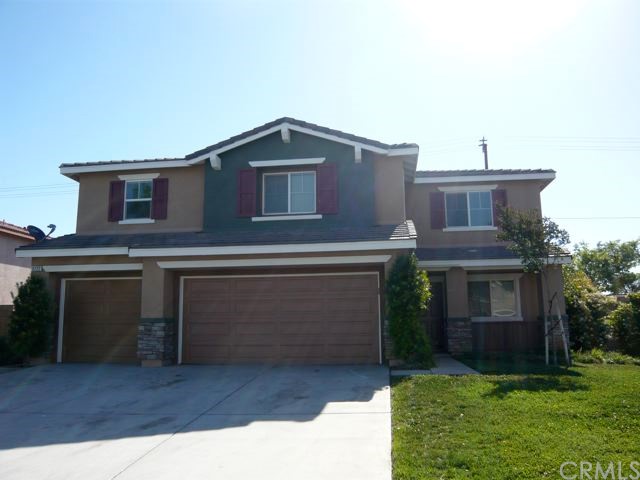 9222 San Rafael Archangel Lane Riverside, CA 92508 - Photo 1 of 1 a front view of a house with garden