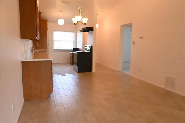 a view of a kitchen with wooden floor