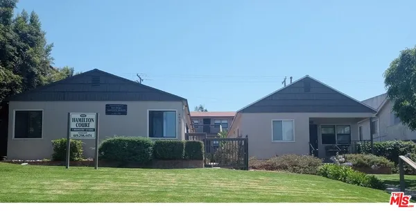 a front view of a house with yard