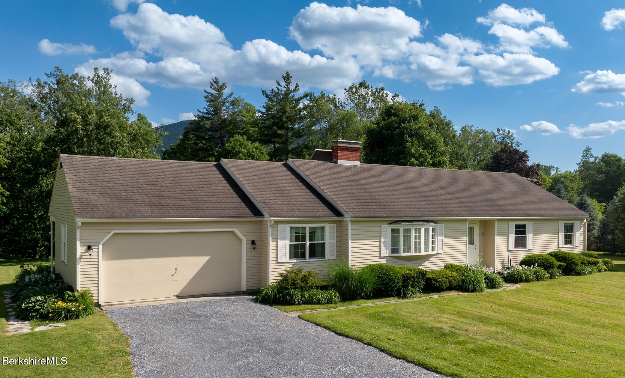 a aerial view of a house with a yard