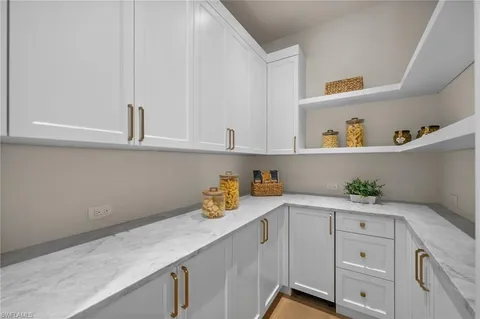 a dining room with furniture a rug and a large window