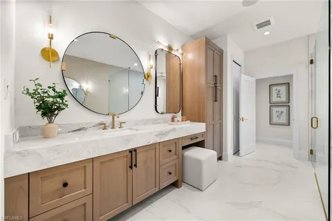 a bedroom with a bed next to a window