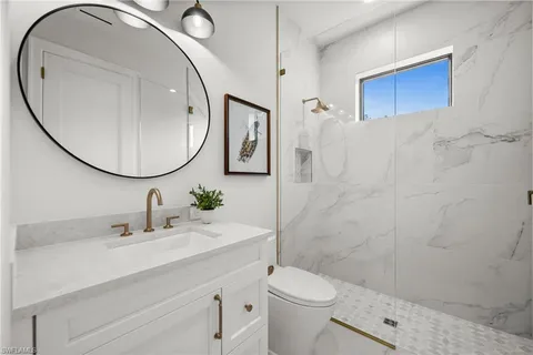 a bedroom with a bed and dresser