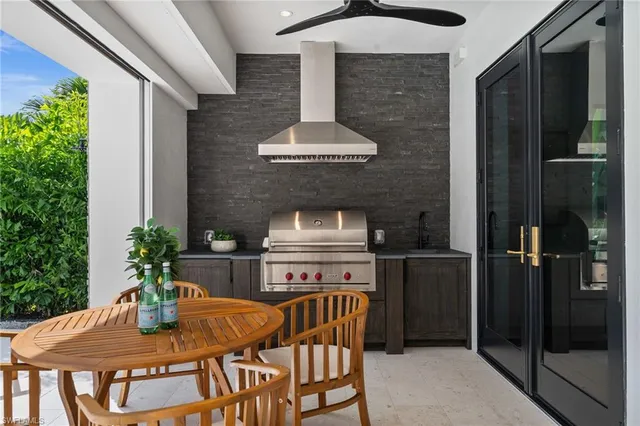a table and chairs in front of a door