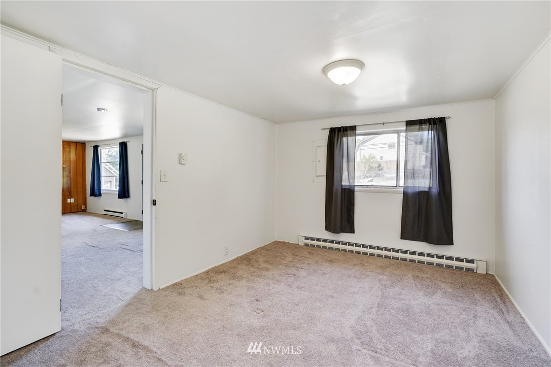 14019 Chain Lake Road Monroe, WA 98272 - Photo 11 of 32 wooden floor in an empty room with a window