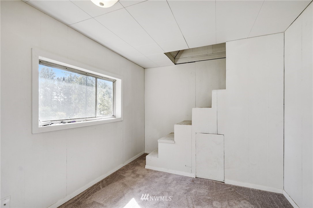 14019 Chain Lake Road Monroe, WA 98272 - Photo 20 of 32 a view of room with stairs and windows