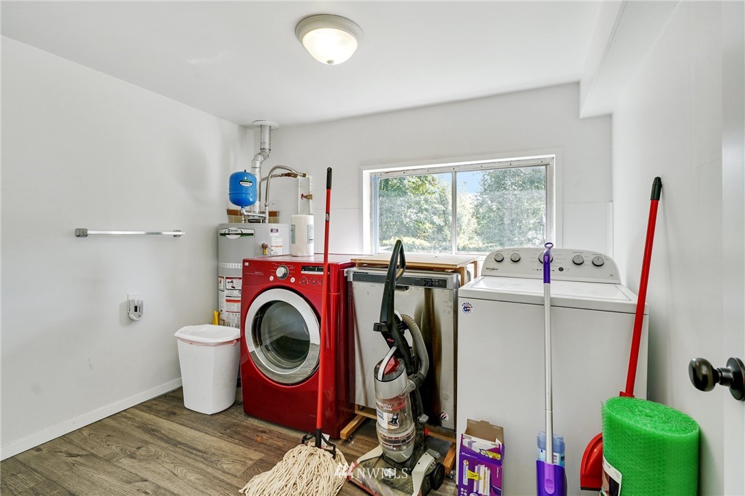14019 Chain Lake Road Monroe, WA 98272 - Photo 22 of 32 a utility room with dryer and washer