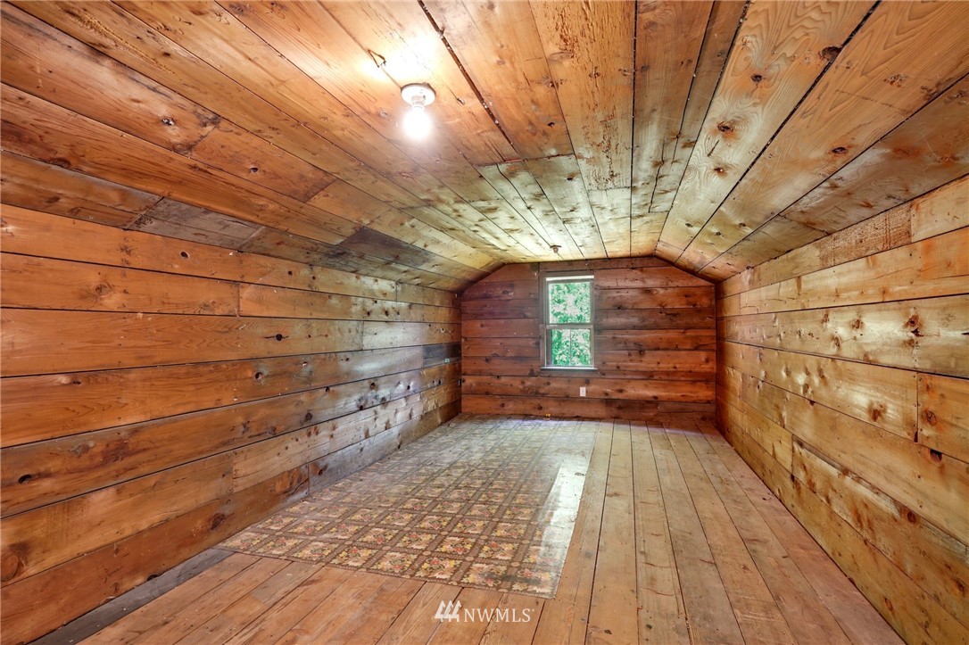 14019 Chain Lake Road Monroe, WA 98272 - Photo 27 of 32 a view of empty room with wooden floor