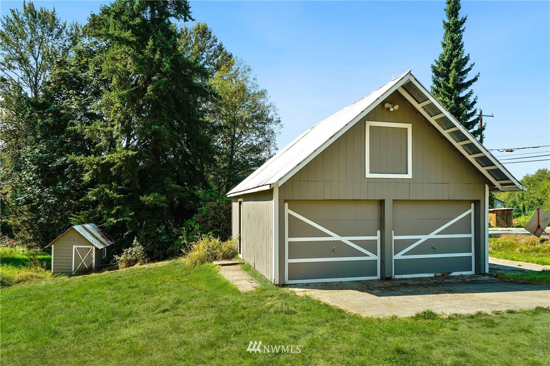 14019 Chain Lake Road Monroe, WA 98272 - Photo 29 of 32 a view of a house with backyard and garden