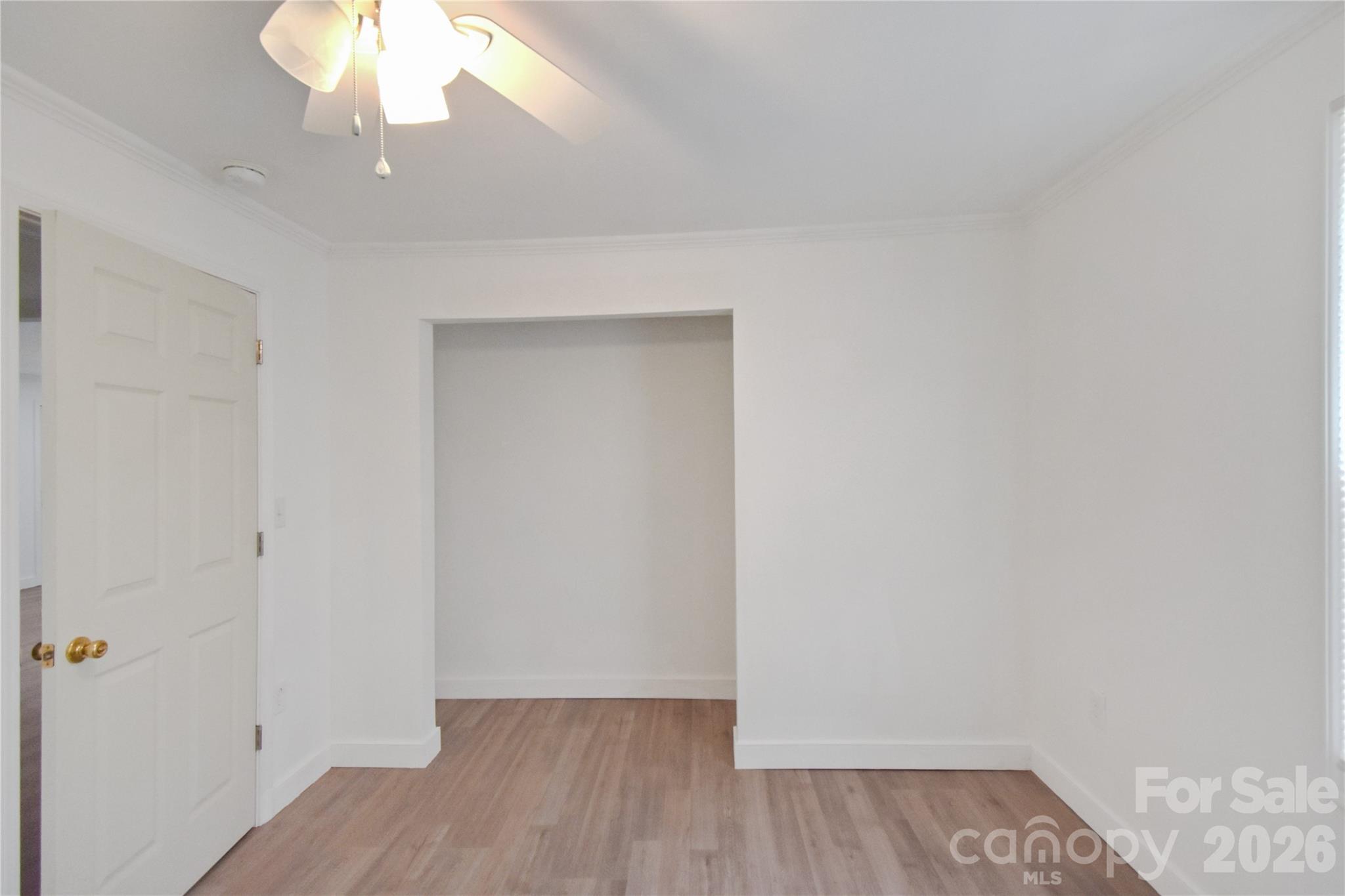 622 Green St Loop Marion, NC 28752 - Photo 13 of 16 an empty room with wooden floor and windows