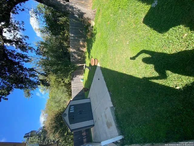 a view of backyard with green space