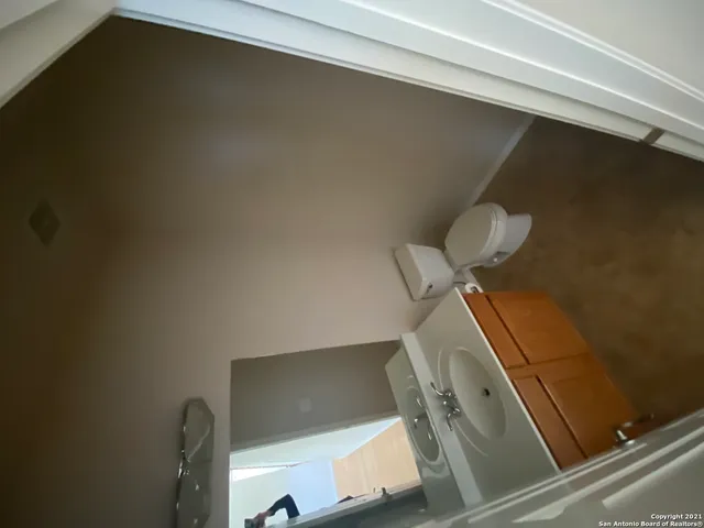 a kitchen with sink refrigerator and window