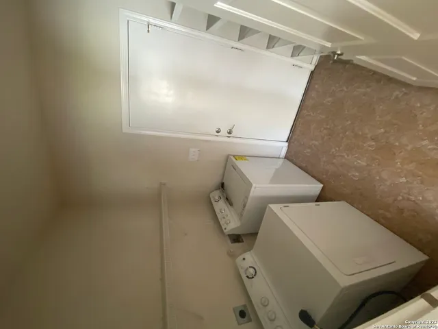 a view of room with wooden floor